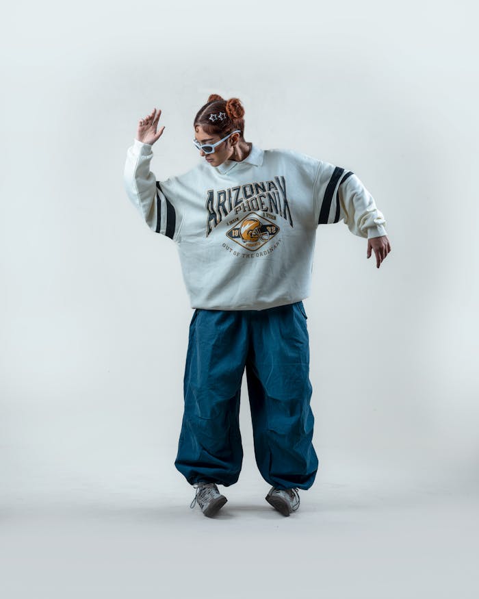 services-01 Trendy adult wearing oversized retro clothing, striking a pose with style and attitude.